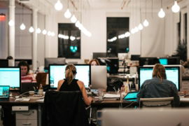 people sitting on chair in front of computer